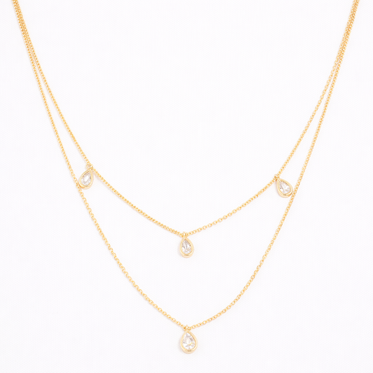 Collier doré multi-chaînes serti de zircons goutte – Élégance fluide